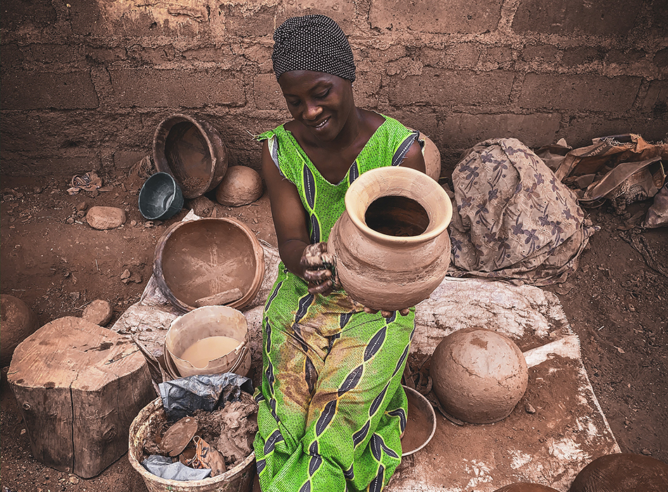 poor women selling clay pot